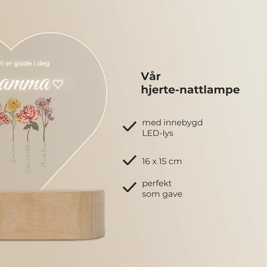 Velora hjertelampe i akryl med barnas navn på fødselsblomster, på sokkel i tre